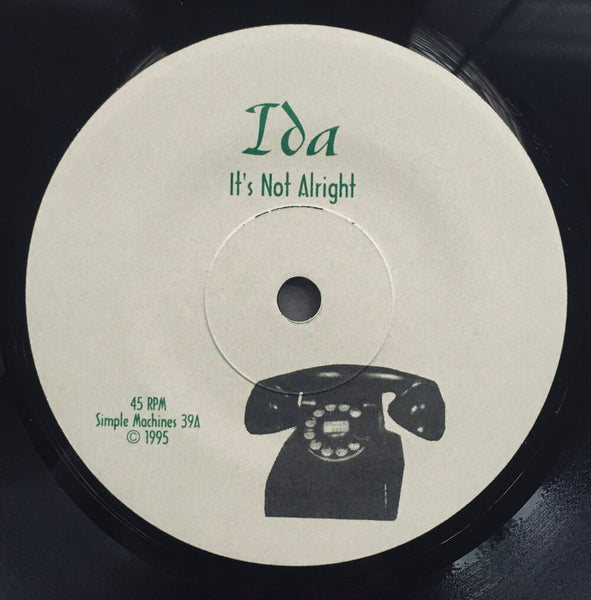 Ida, "It's Not Alright" Single (1995). Record label sticker image. Folk, pop, guitar pop. Simple Machines.