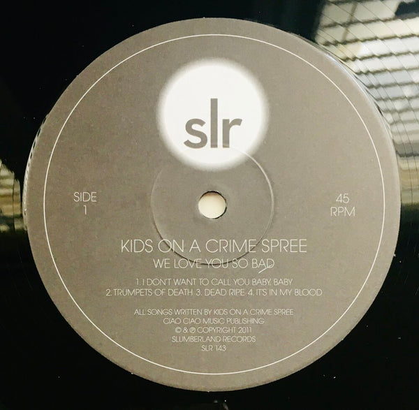 Kids On A Crime Spree, "We Love You So Bad" LP (2011). Record label sticker image. Mario Hernandez and Becky Barron new project, KOACS! Slumberland Records fuzzy garage pop!