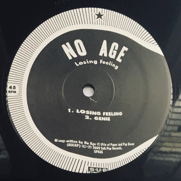 No Age, "Losing Feeling" LP (2009). Record label sticker image. Sub Pop Records.